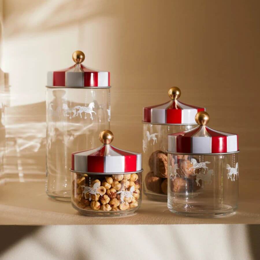 Alessi Jar with hermetic lid Circus Rasia MW3-100 in varying sizes, featuring colorful circus-themed lids.